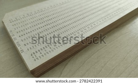 Stack of vintage computer punched cards from 1984. Close-up of retro punch cards for data storage and early programming, computer history concept