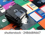 A Stack of vintage floppy disks. Old technologies. Selective focus. Low DOF