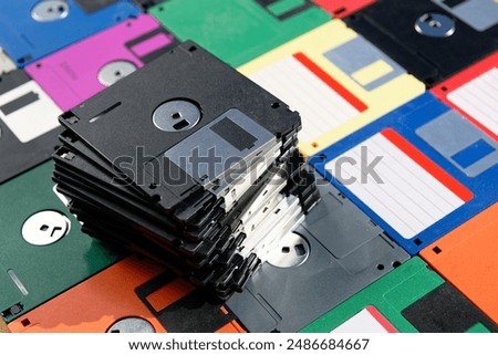 A Stack of vintage floppy disks. Old technologies. Selective focus. Low DOF