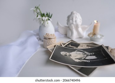 Stack Of Vintage Photos, Baby Photography Of 50s, 60s, Candle Is Lit, First Spring Flowers, Snowdrop, Galanthus In Vase, Concept Of Family Tree, Genealogy, Childhood Memories