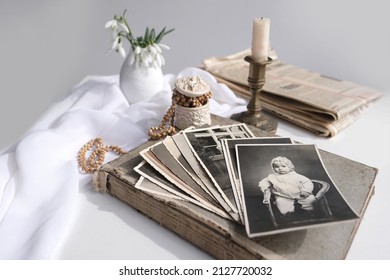 Stack Of Vintage Photos, Baby Photography Of 1960, Candle Is Lit, First Spring Flowers, Snowdrop, Galanthus In Vase, Concept Of Family Tree, Genealogy, Childhood Memories