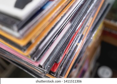 Stack of vinyl LP records inside a vinyl shop. Vintage music store.