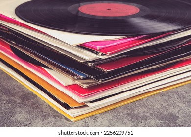 stack of vinyl records with music