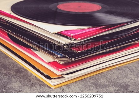 stack of vinyl records with music