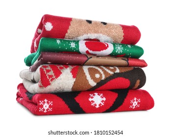 Stack Of Warm Christmas Sweaters Isolated On White