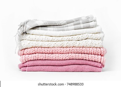 Stack of warm clothes sweaters and plaid. 