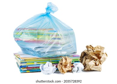 Stack of wastepaper in blue plastic packet isolated on white background. School waste paper. Paper recycling