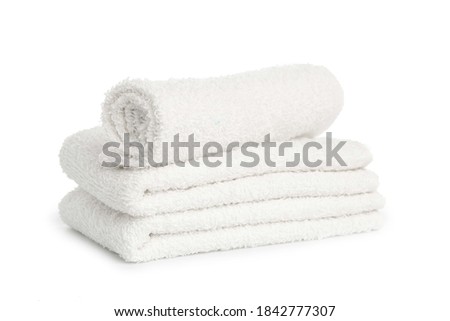 stack of white beach soft towels folded on white background