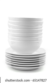 A Stack Of White Dishes En Soup Bowls Isolated On White