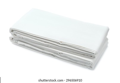 Stack Of White Folded Bedding Isolated On White