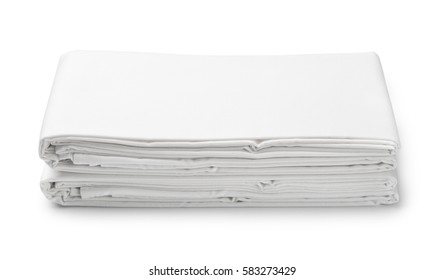 Stack Of White Folded Bedding Sheets Isolated On White