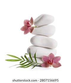 Stack of white spa stones with pink orchids and green leaf