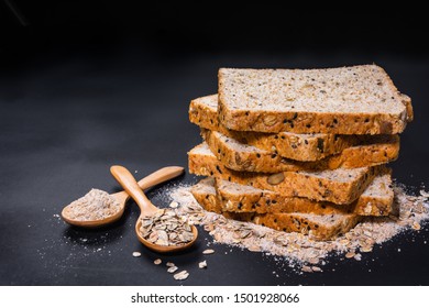 stack of whole wheat bread on black table