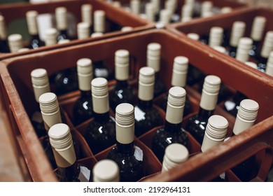 Stack of wine bottles in cellar - Powered by Shutterstock