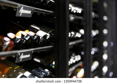 Stack of wine bottles in an old dark wine cellar. Champagne bottles. Spirits & liquor store - Powered by Shutterstock - Get 15% off with code: PIKWIZARD15