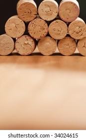 Stack of Wine Corks on a Wood Surface.