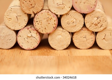 Stack of Wine Corks on a Wood Surface.