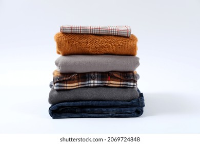 Stack Of Winter Clothes Isolated On White Background.