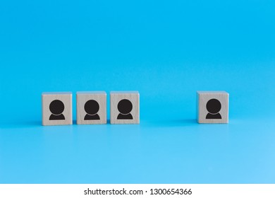 Stack Of Wooden Cubes On Blue Background. Business Concept For Human Resources, Teamwork And Employee Classification