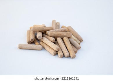 A Stack Of Wooden Dowel.