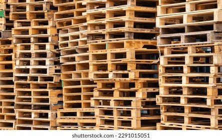 Stack of wooden pallet. Industrial wood pallet at factory warehouse. Cargo and shipping concept. Sustainability of supply chains. Eco-friendly nature and sustainable properties. Renewable wood pallet.