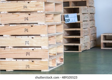 Stack of wooden pallets with export label.