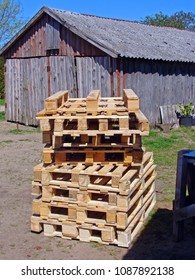 Stack of wooden pallets from new fresh boards and logs                                - Shutterstock ID 1087892138
