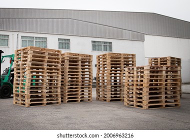 Stack of Wooden Pallets Rack in Storage Warehouse.	
