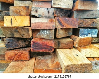 Stack Of Wooden Plank Or Beams For House Construction. Close Up Of Wooden Boards.