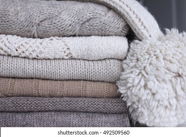 Stack of wool knitted sweaters.