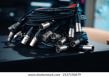 A stack of XLR Audio Cables coiled in a pile.
