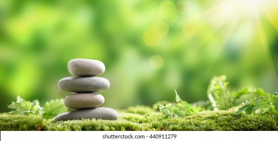 Stack of zen stones on nature background - Shutterstock ID 440911279
