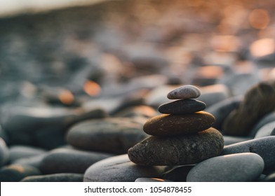 stack of zen stones on pebble beach