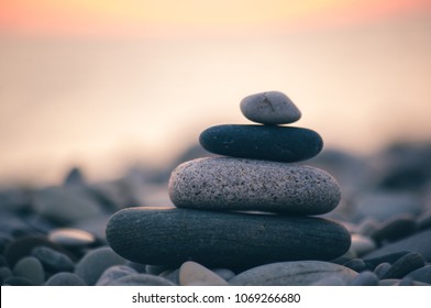 stack of zen stones on pebble beach