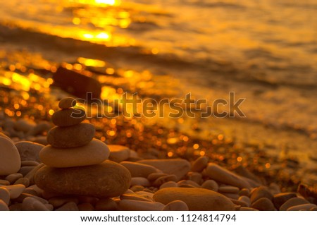 stack of zen stones on pebble beach