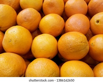 Stacked And Aligned Oranges. Overhead Shot. Oranges In A Grocery Store 