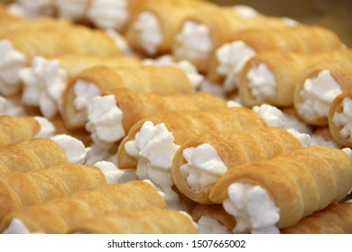 Stacked austrian pastries - cream horns rolls Schillerlocken Schaumrollen for sweet pastry