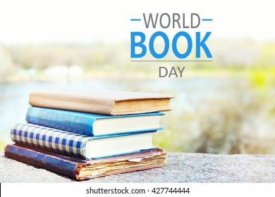 Stacked books on bright background. World Book Day poster