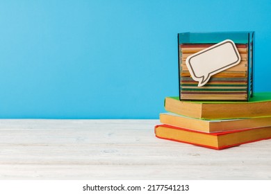 Stacked Books On Wooden Desk Front View