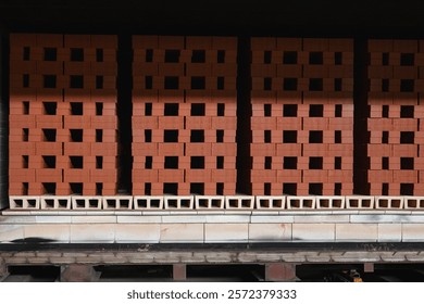 Stacked bricks in drying process at brick production facility move to oven