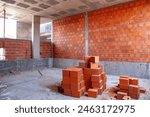 Stacked bricks ready for construction, symbolizing progress and development in the building industry.