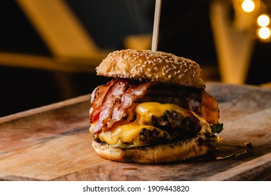 Stacked Burger With Meat, Bacon, Cheese, Mushrooms And Sauce