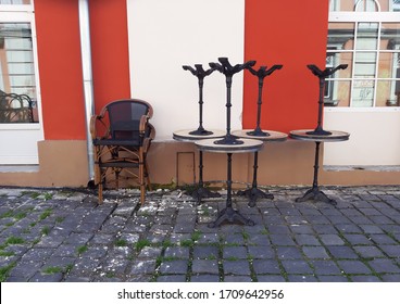 Stacked Chairs Of A Closed Outdoor Restaurant.