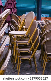 Stacked Chairs In A Restaurant Outside