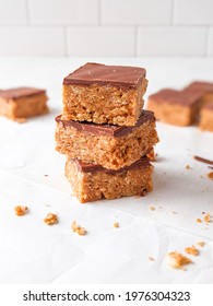 Stacked Chocolate Peanut Butter Cereal Bars. Bright White Back Drop.