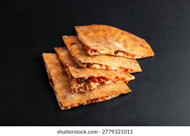 Stacked Crispy Cheese Stuffed Flatbread Slices, Goldenbrown Triangles With Melted Cheese And Tomato Bits, Slight Char Marks, Arranged On Dark Slate,