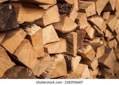 Stacked firewood. Preparation of firewood for the winter