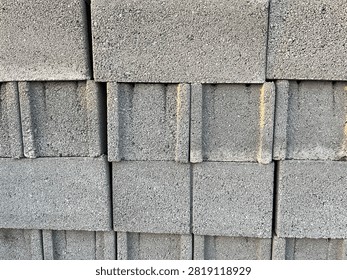 Stacked Gray Cinder Blocks Construction Material Texture
Close up of gray concrete cinder blocks stacked for construction. Building materials, industry, architecture background.