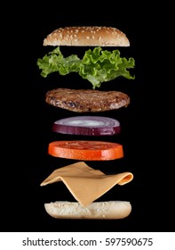 Stacked Juicy Hamburger Ingredients Isolated On Black. Fast Food Menu Cover