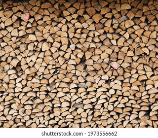 stacked loggs of fire wood texture background . High quality photo